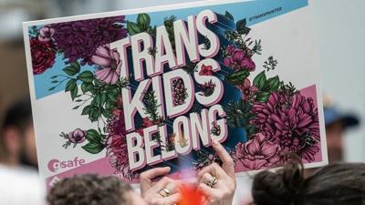 Protest Sign Reading "Trans Kids Belong"